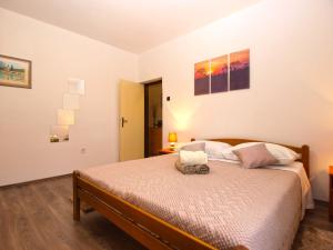 Postel nebo postele na pokoji v ubytování Apartment Luciano 1540