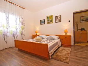 Postel nebo postele na pokoji v ubytování Apartment Luciano 1540