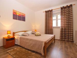 Postel nebo postele na pokoji v ubytování Apartment Luciano 1540