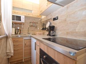 Kuchyň nebo kuchyňský kout v ubytování Apartment Luciano 1540
