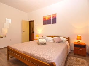 Postel nebo postele na pokoji v ubytování Apartment Luciano 1540