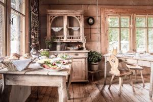 a kitchen with a table with food on it at Leśniczówka u Zięby in Kościelisko