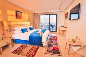 Postel nebo postele na pokoji v ubytování Hotel Cote ocean Mogador