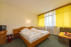 Posteľ alebo postele v izbe v ubytovaní Hotel Nostra