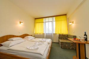 Posteľ alebo postele v izbe v ubytovaní Hotel Nostra