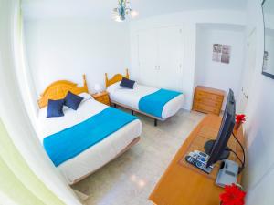 Posteľ alebo postele v izbe v ubytovaní Homely Apartments Club Nautico