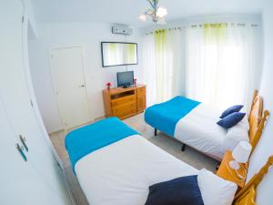 Posteľ alebo postele v izbe v ubytovaní Homely Apartments Club Nautico