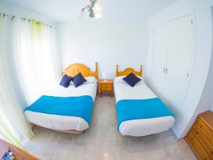 Posteľ alebo postele v izbe v ubytovaní Homely Apartments Club Nautico