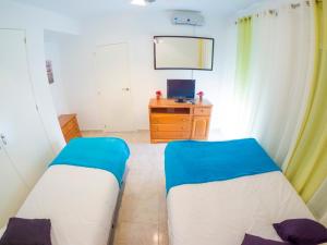 Posteľ alebo postele v izbe v ubytovaní Homely Apartments Club Nautico