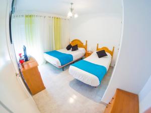 Posteľ alebo postele v izbe v ubytovaní Homely Apartments Club Nautico + 37 fotografií