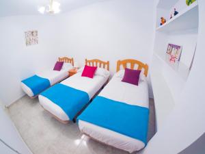 Posteľ alebo postele v izbe v ubytovaní Homely Apartments Club Nautico