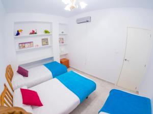 Posteľ alebo postele v izbe v ubytovaní Homely Apartments Club Nautico