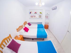 Posteľ alebo postele v izbe v ubytovaní Homely Apartments Club Nautico