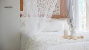 Voodi või voodid majutusasutuse Ecosuite & SPA toas