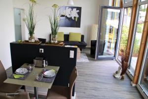 a living room with a table and a couch at ADAC Campingplatz in Möhnesee