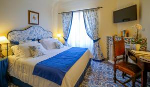Postel nebo postele na pokoji v ubytování Hotel Villa Cimbrone