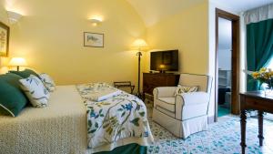 Postel nebo postele na pokoji v ubytování Hotel Villa Cimbrone