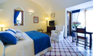 Postel nebo postele na pokoji v ubytování Hotel Villa Cimbrone