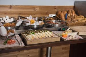 a buffet with many different types of food on a table at Villa Nazareth - Boutique hotel in a central location in Nazareth +11 photos