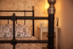 Postel nebo postele na pokoji v ubytování Cento Passi dal Duomo B&B
