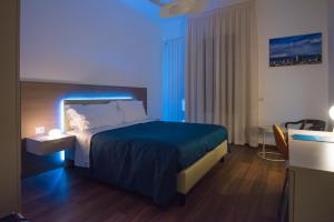 Ένα ή περισσότερα κρεβάτια σε δωμάτιο στο Enjoy Milano Skyline