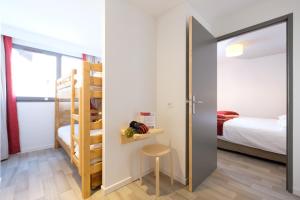 Postel nebo postele na pokoji v ubytování Village Le Grand Fourchon