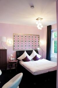 Ein Bett oder Betten in einem Zimmer der Unterkunft Kleine Villa Frankfurt