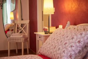 Postel nebo postele na pokoji v ubytování Cento Passi dal Duomo B&B