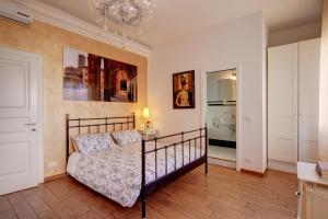 Postel nebo postele na pokoji v ubytování Cento Passi dal Duomo B&B