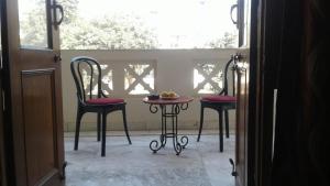 Balkón nebo terasa v ubytování Pamposh Guest House, Gurgaon