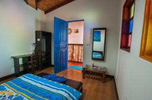 Postel nebo postele na pokoji v ubytování Casa Hospedaje La Bohemia