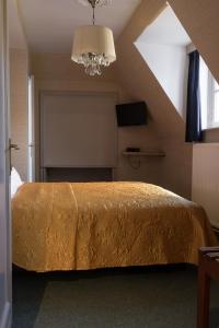 Postel nebo postele na pokoji v ubytování Hotel Duc De Bourgogne