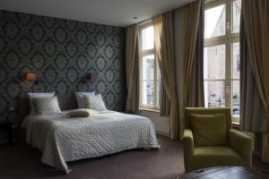 Postel nebo postele na pokoji v ubytování Hotel Duc De Bourgogne