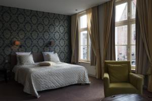 Кровать или кровати в номере Hotel Duc De Bourgogne