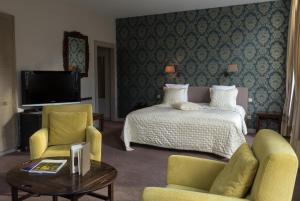 TV a/nebo společenská místnost v ubytování Hotel Duc De Bourgogne