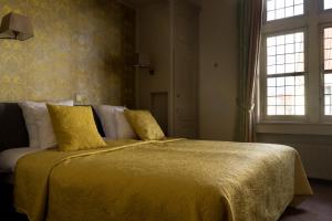 Postel nebo postele na pokoji v ubytování Hotel Duc De Bourgogne