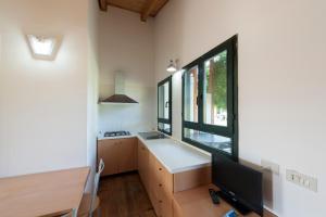 TV a/nebo společenská místnost v ubytování Settebello Village