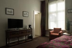 TV a/nebo společenská místnost v ubytování Hotel Duc De Bourgogne