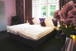 Ein Bett oder Betten in einem Zimmer der Unterkunft Kleine Villa Frankfurt