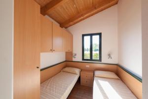 Postel nebo postele na pokoji v ubytování Settebello Village
