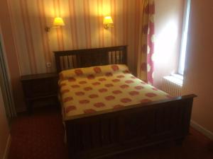 Postel nebo postele na pokoji v ubytování Le relais de l'Argoat