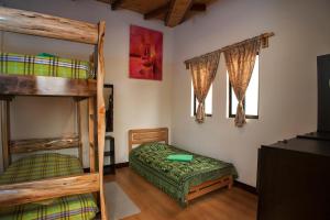 Postel nebo postele na pokoji v ubytování Casa Hospedaje La Bohemia