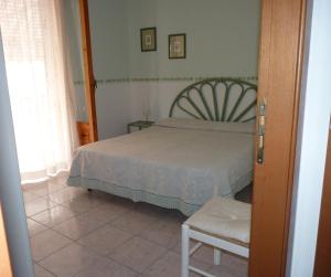 Postel nebo postele na pokoji v ubytování Claudia - case vacanze a Canneto spiaggia