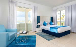 Rúm í herbergi á Hotel Farah Tanger