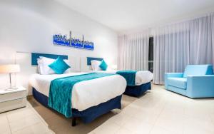 Rúm í herbergi á Hotel Farah Tanger