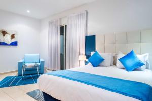 Rúm í herbergi á Hotel Farah Tanger