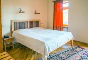Postel nebo postele na pokoji v ubytování Hotel Mirhav