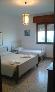 
A bed or beds in a room at App.ti Scala Dei Turchi Tetide
