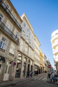 a group of buildings on a city street at Almada Story Apartments by Porto City Hosts in Porto