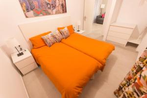 A bed or beds in a room at Luminoso apart Mareverde